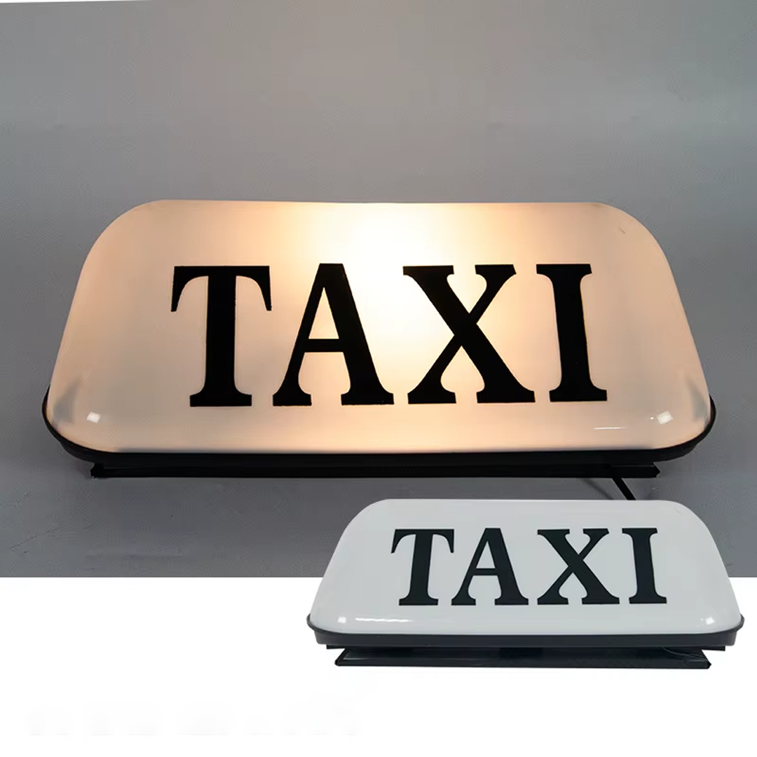 Znak TAXI na dachu