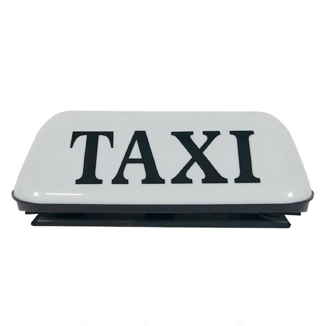 Znak TAXI na dachu