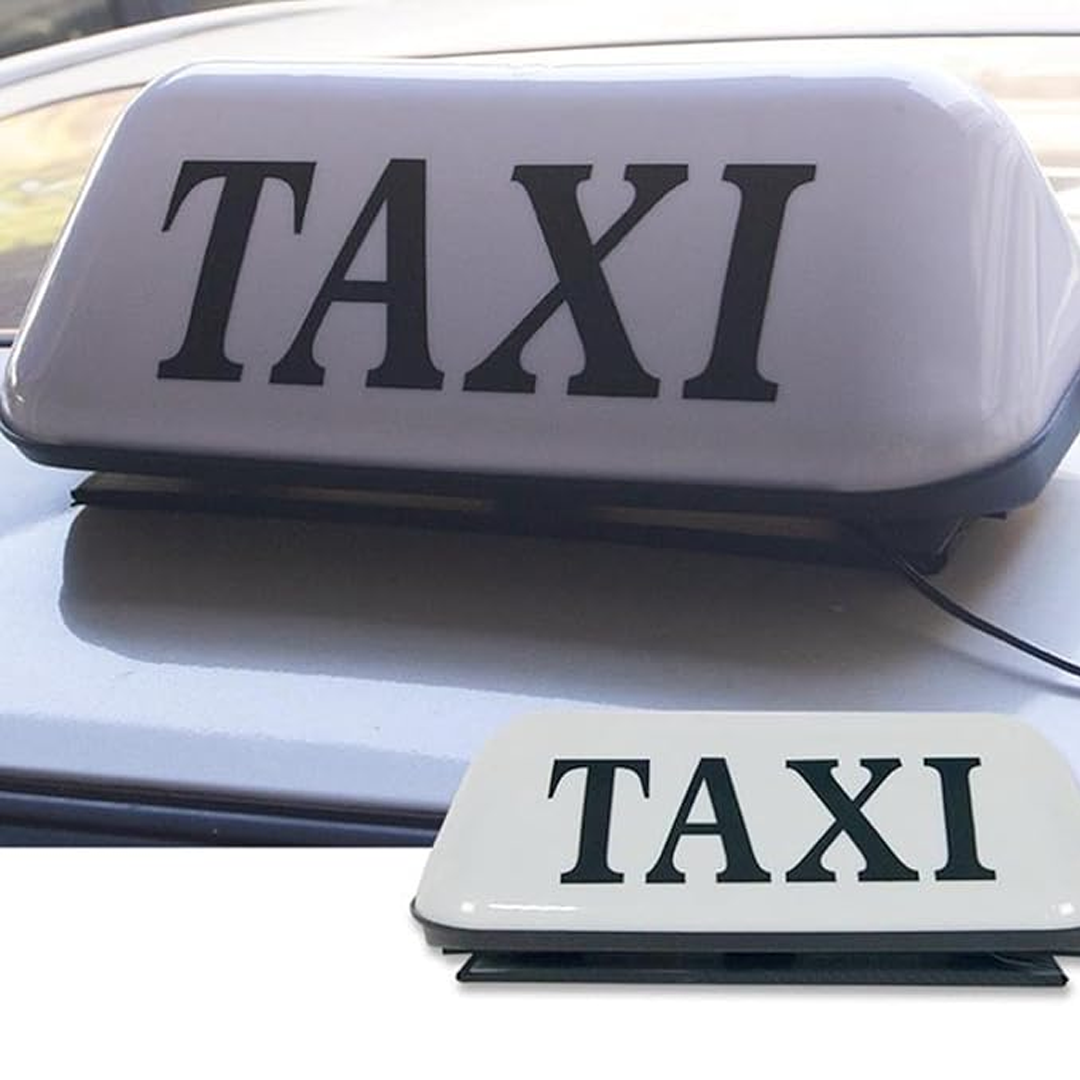 Znak TAXI na dachu